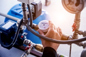 Technician checking water system nodes.