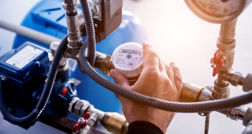 Technician checking water system nodes.